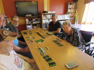 Residents playing The Oregon Trail card Game on FRI 4-26-19